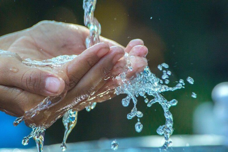 Hands and water.